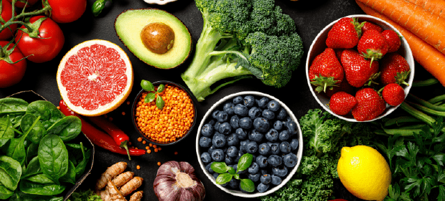 A vibrant plate of fresh fruits and vegetables, representing a nourishing and balanced approach to healthy eating.